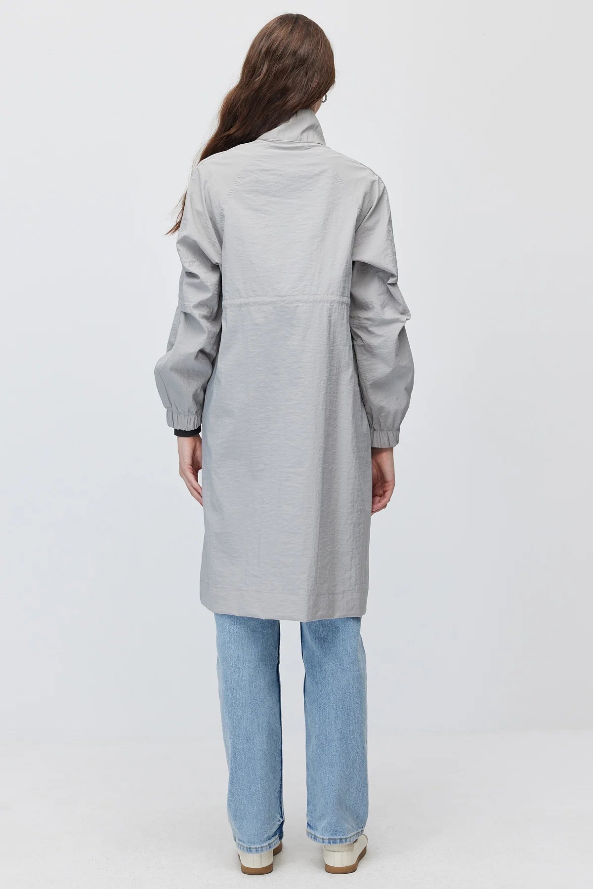 Women's long, zip-up raincoat with a stand-up collar