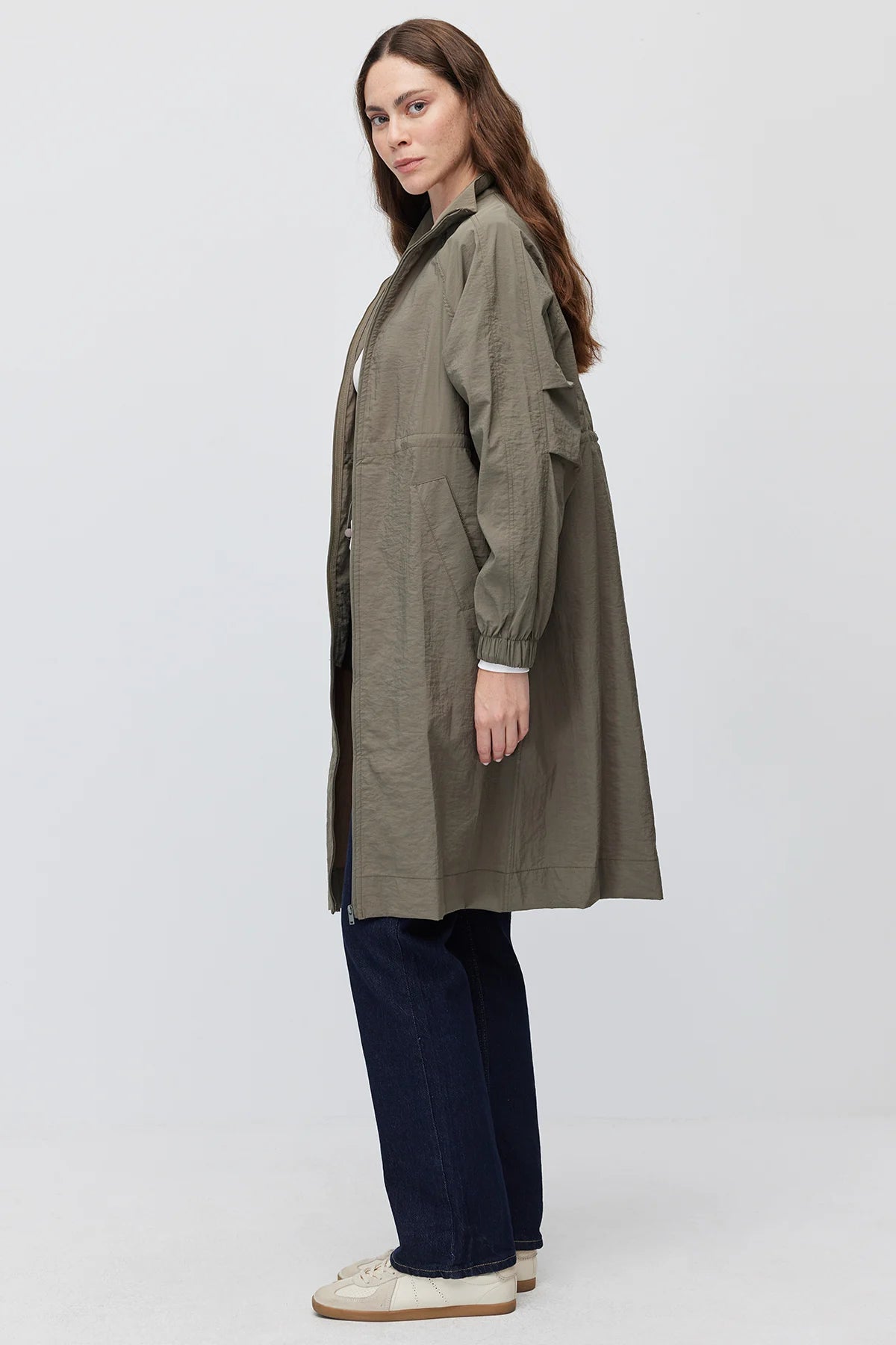 Women's long, zip-up raincoat with a stand-up collar
