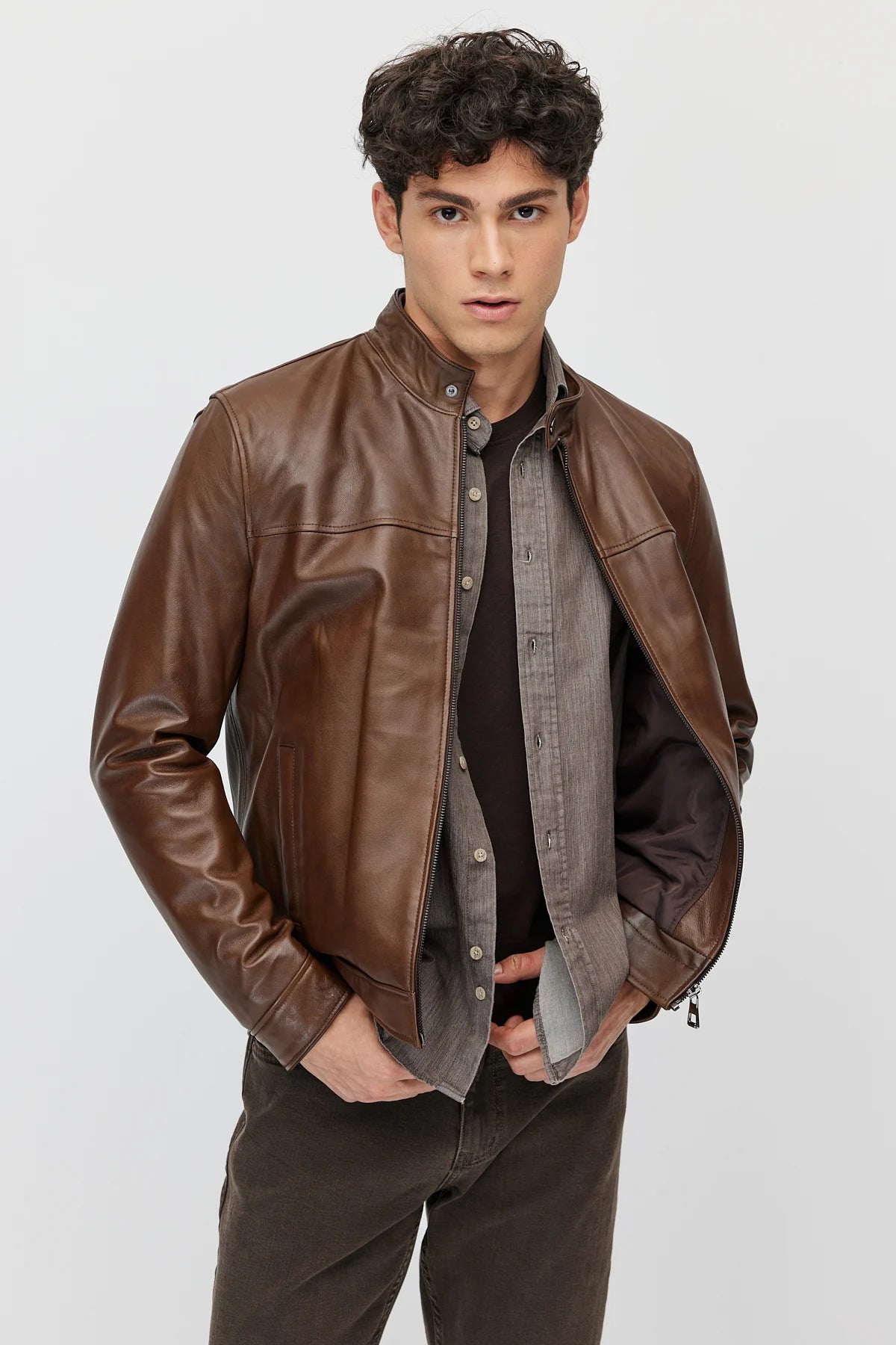 Men's leather jacket with zipper and double pockets.