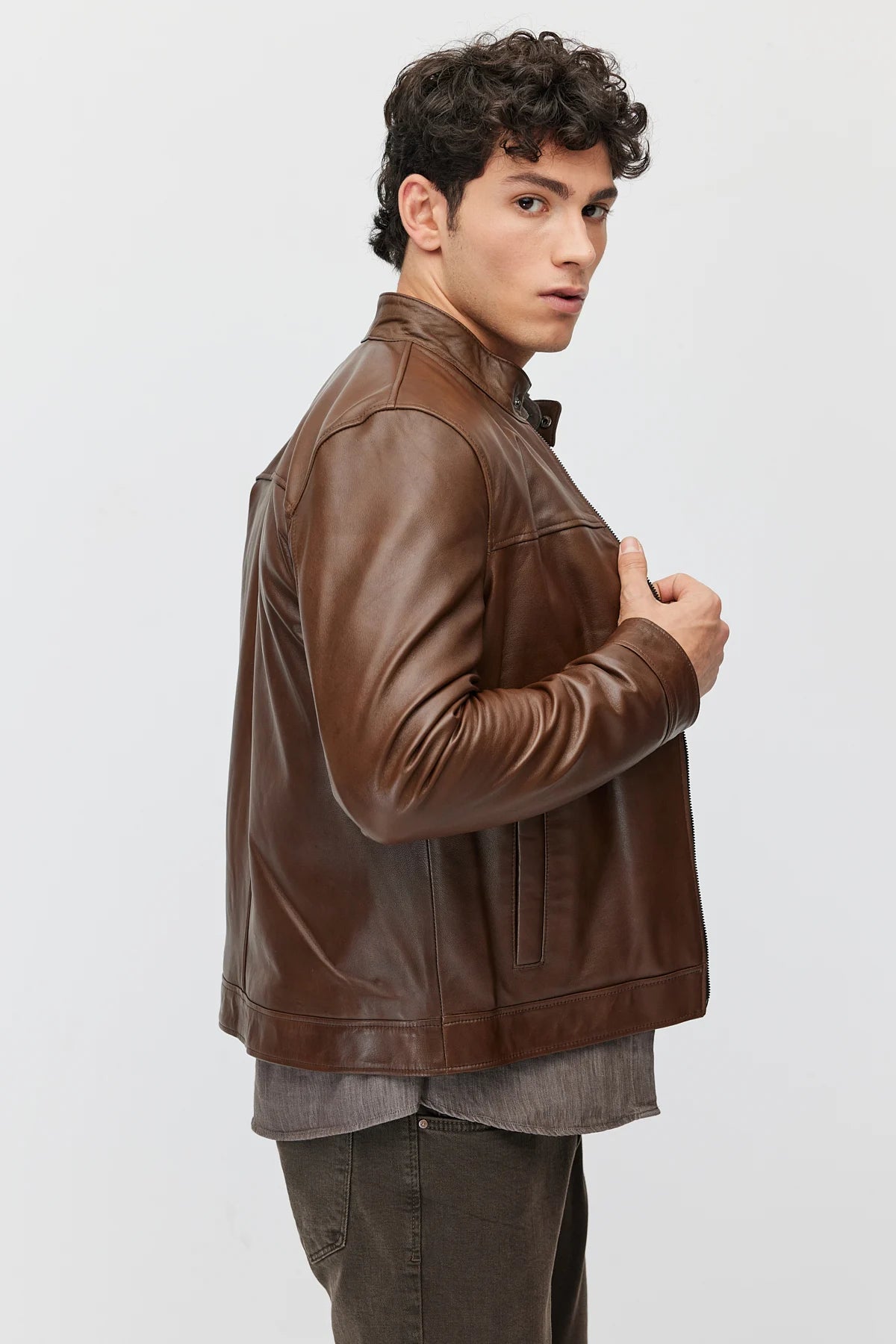 Men's leather jacket with zipper and double pockets.