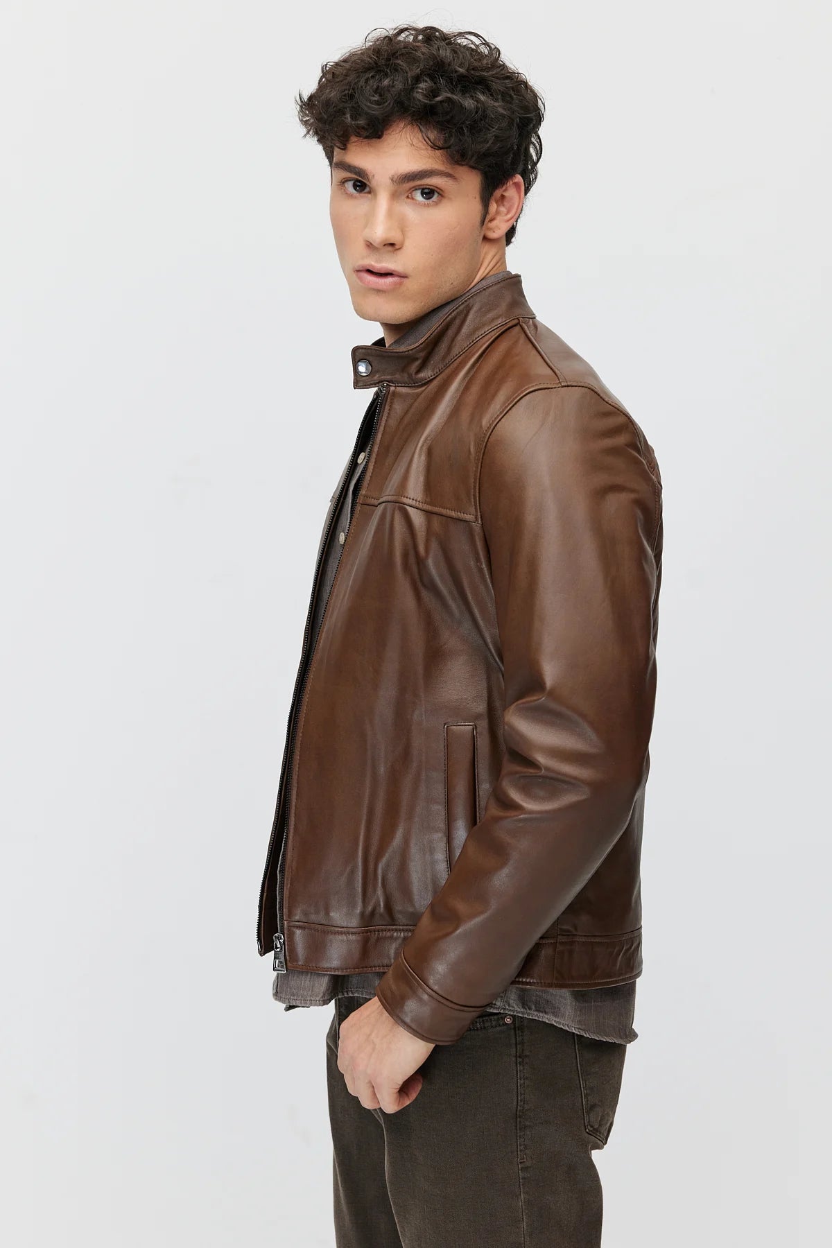 Men's leather jacket with zipper and double pockets.